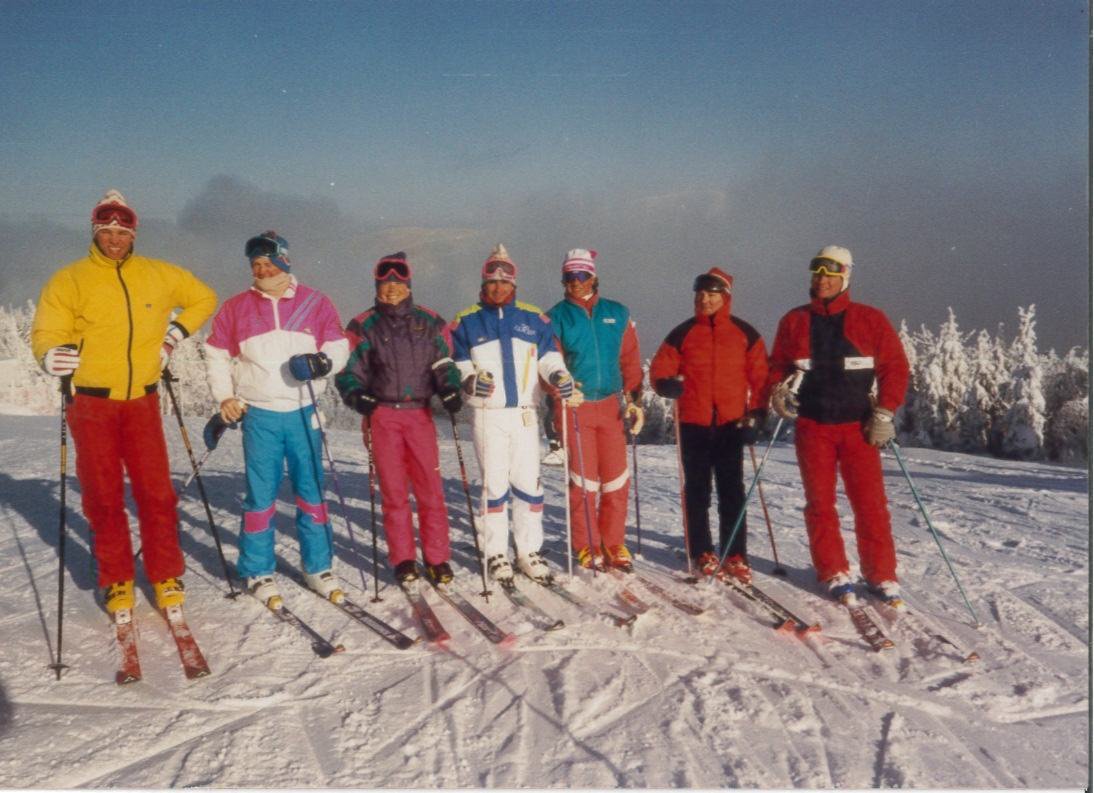A group of skiers in retro one-piece suits at Martock