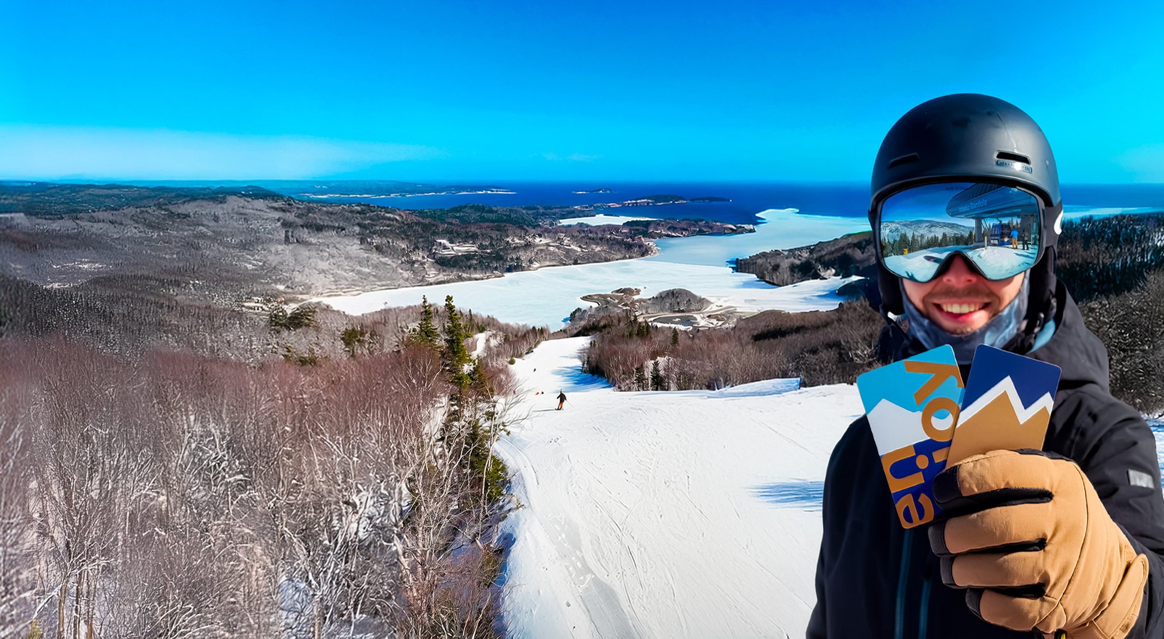 East Peak Pass holder on the slopes with two season passes