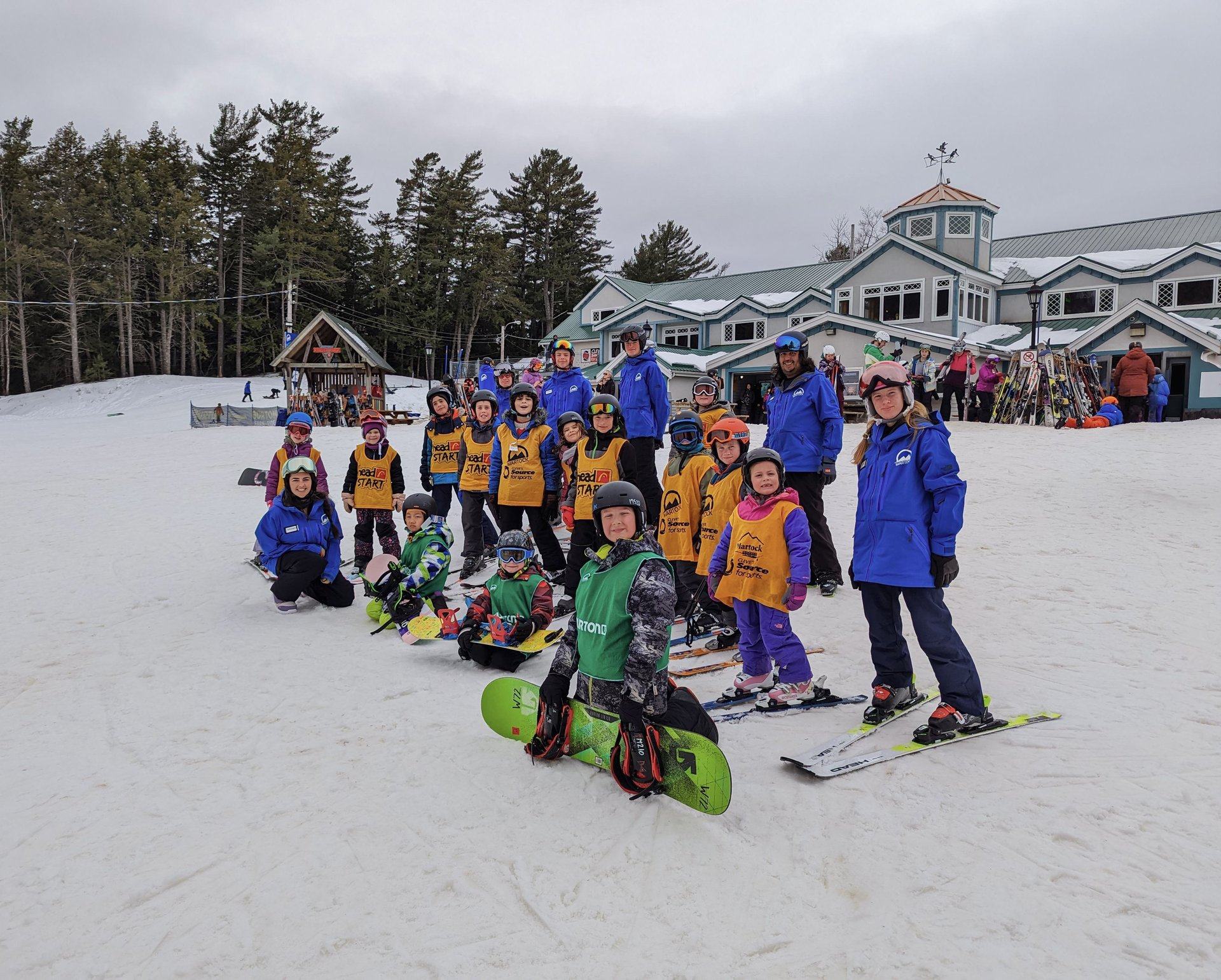 A group gathered in front of the Martock lodge