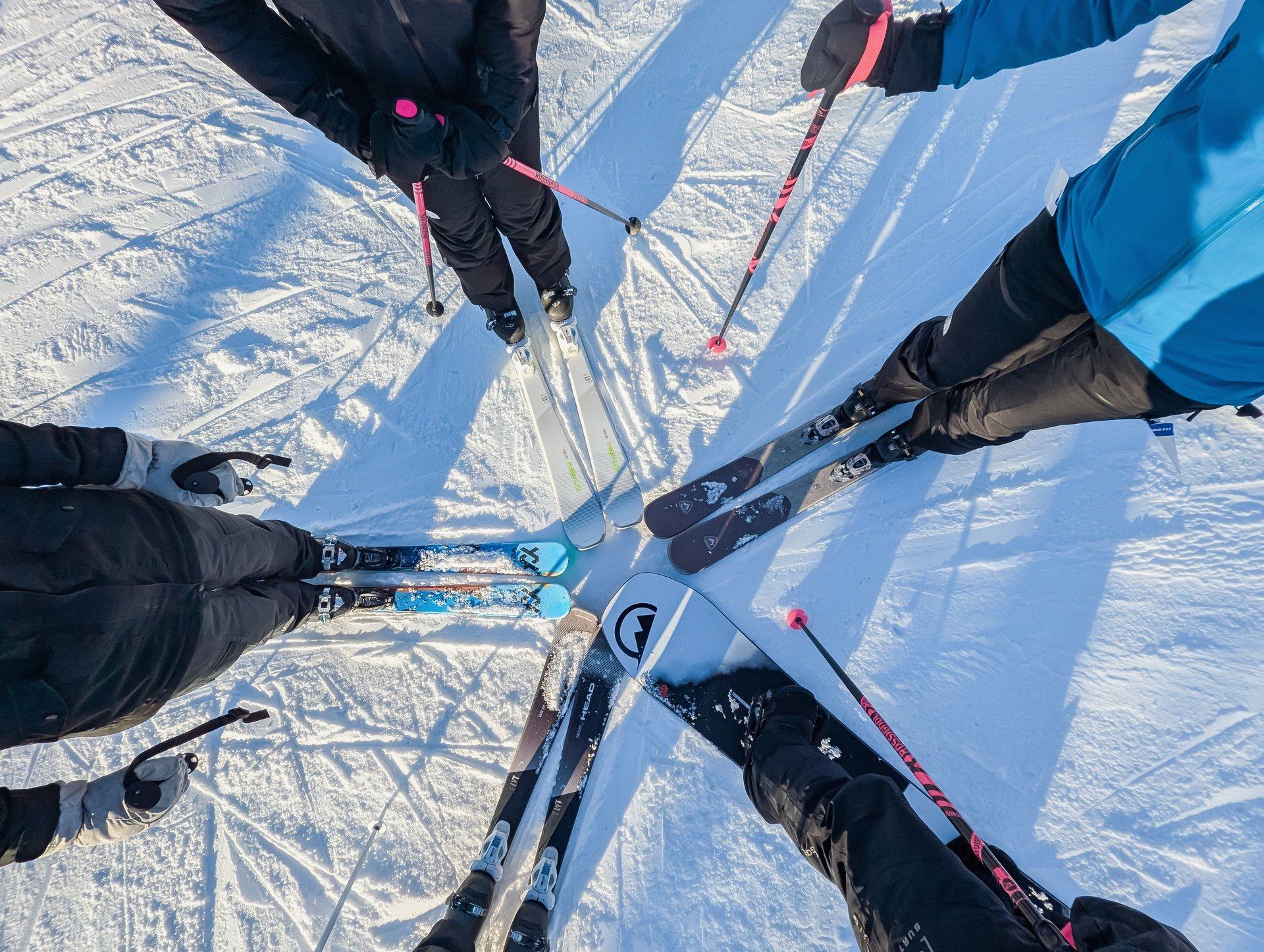 Skis and snowboards fanned out on the snow