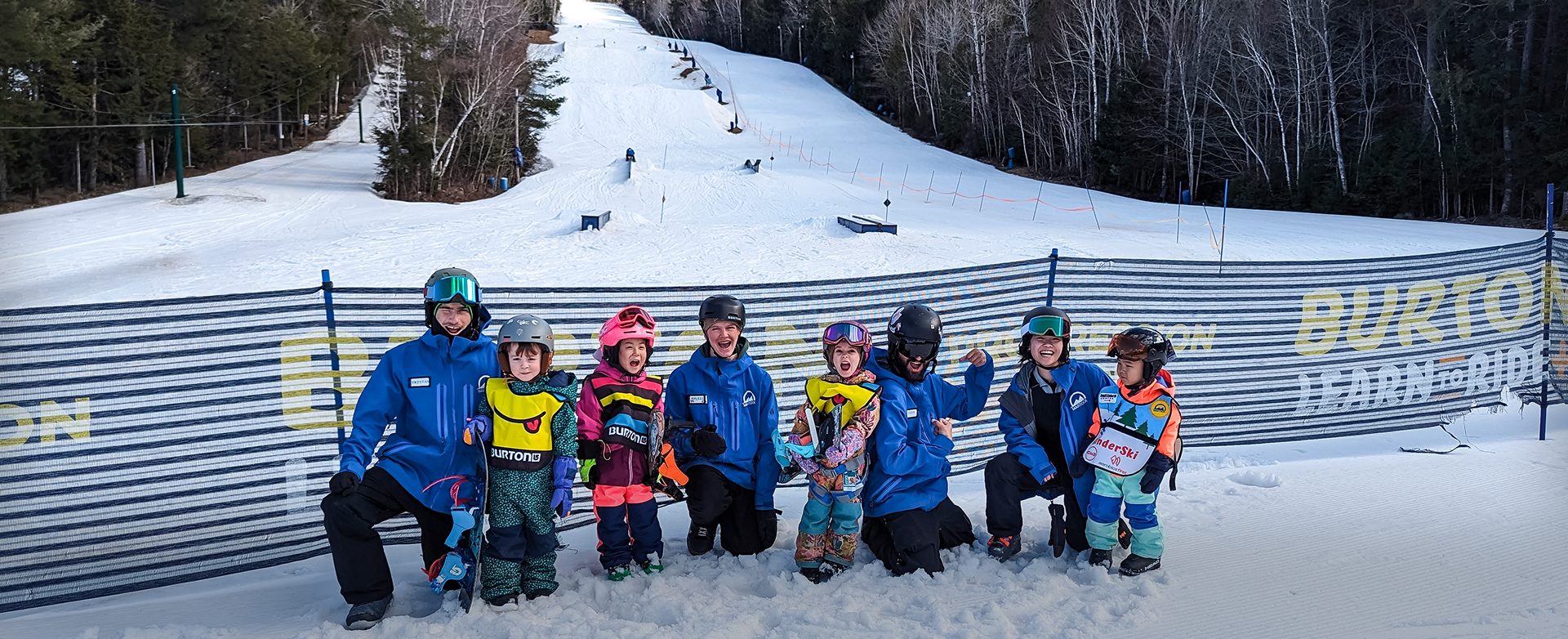 A Martock instructor with a group of young skiers