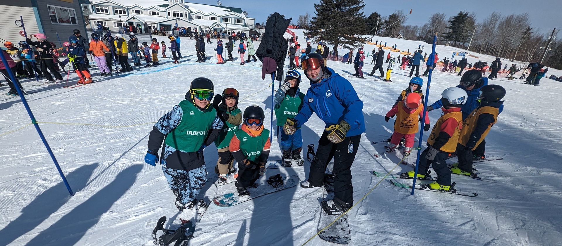 A Martock instructor with a group of young skiers