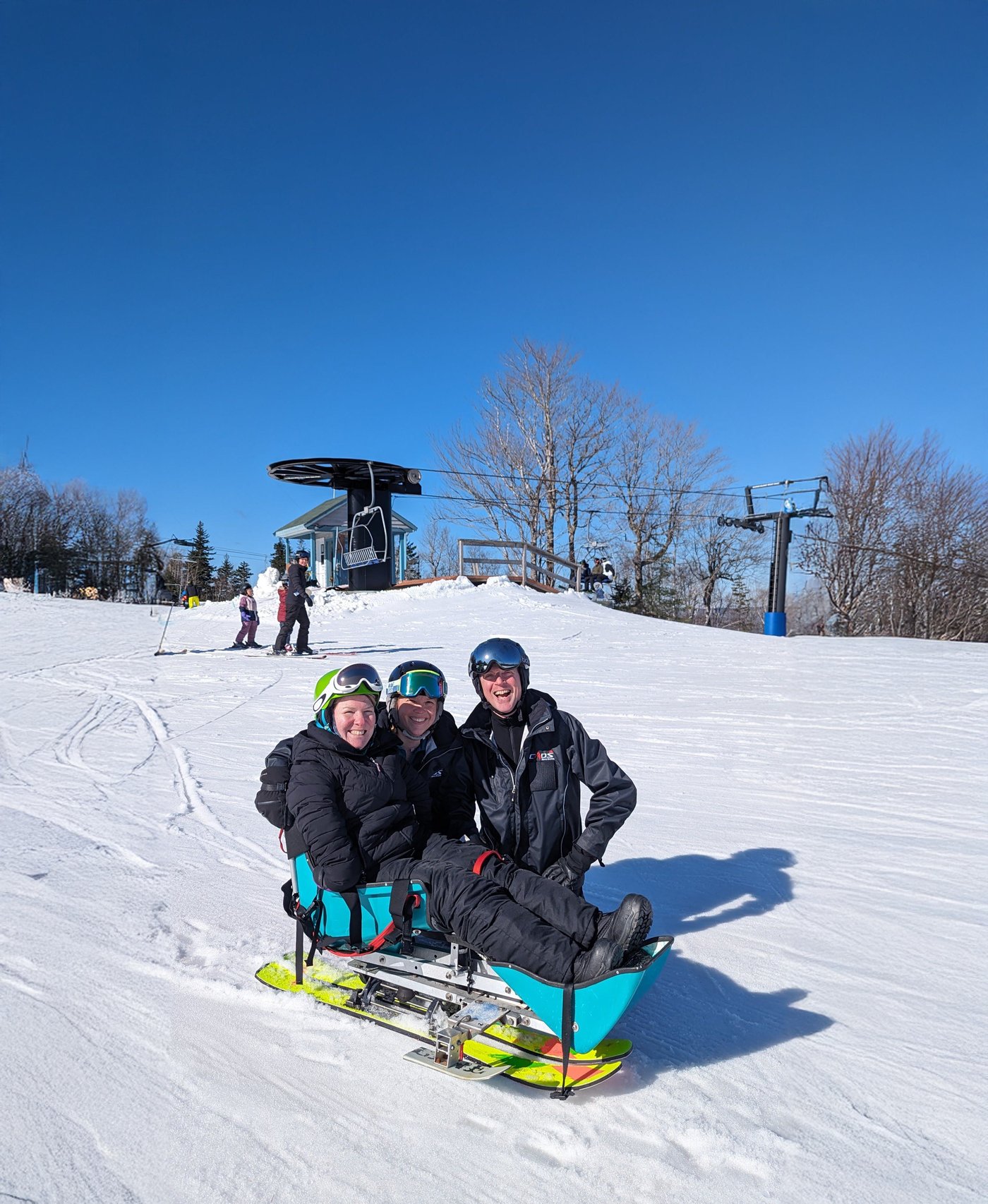 Adaptive sit-ski session with Martock instructors